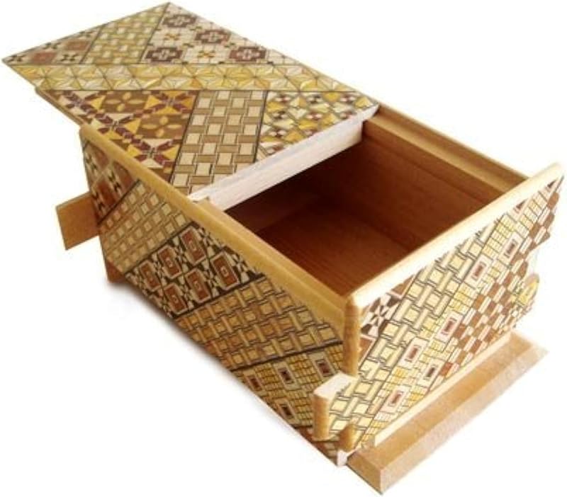 Open yosegi puzzle box with its end panel slid aside to show the compartment